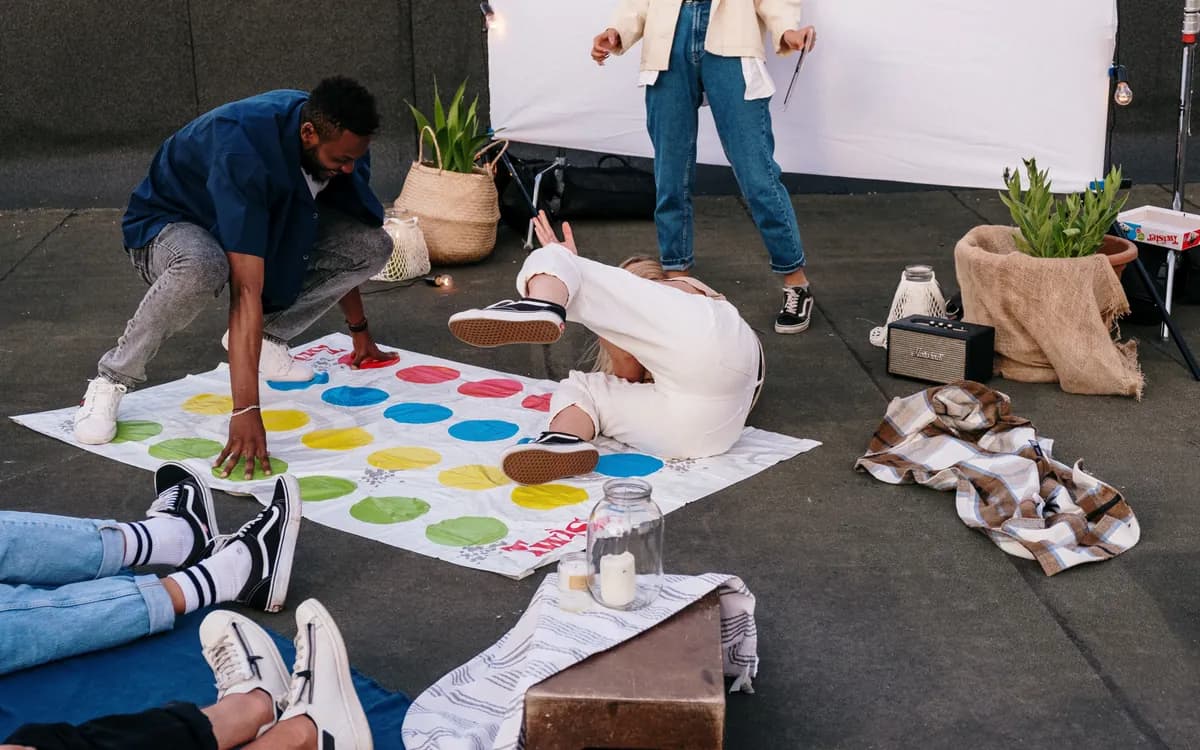 Guests playing a floor game together outdoors